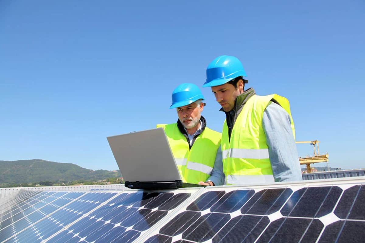 Technicians checking a solar plant.